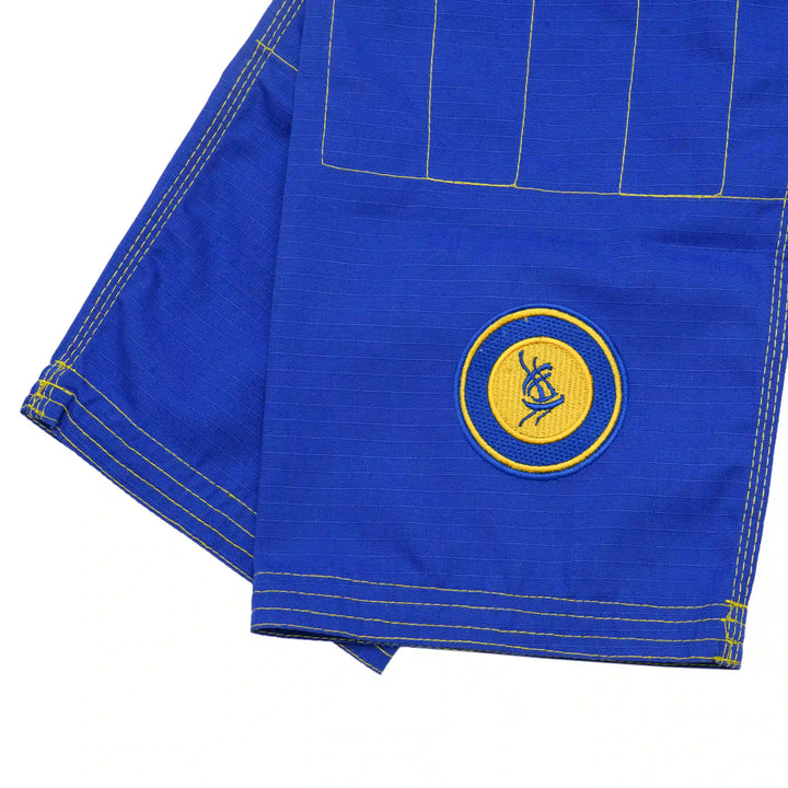 Close-up front of Sahib lightweight blue ripstop BJJ pants for youth