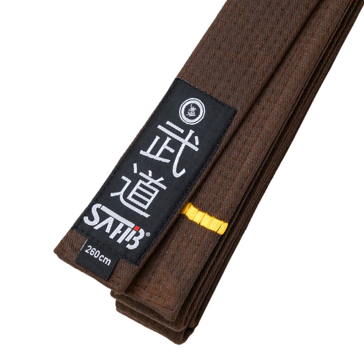 Close-up of brown karate belt with one gold stripe and 9-row stitching