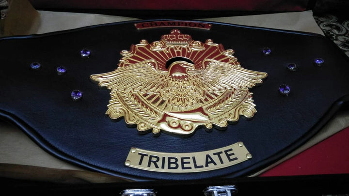 Detailed side plate engraving on personalized championship belt.