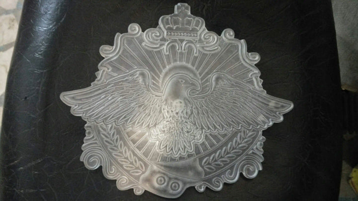 Die mold used to shape the main eagle plate for a handcrafted custom championship belt.