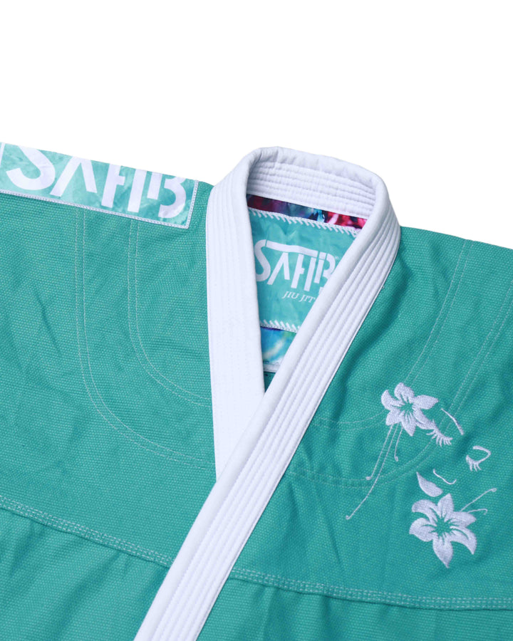 Close-up of floral embroidery and texture on Sahib Girl Power green Jiu Jitsu Gi jacket