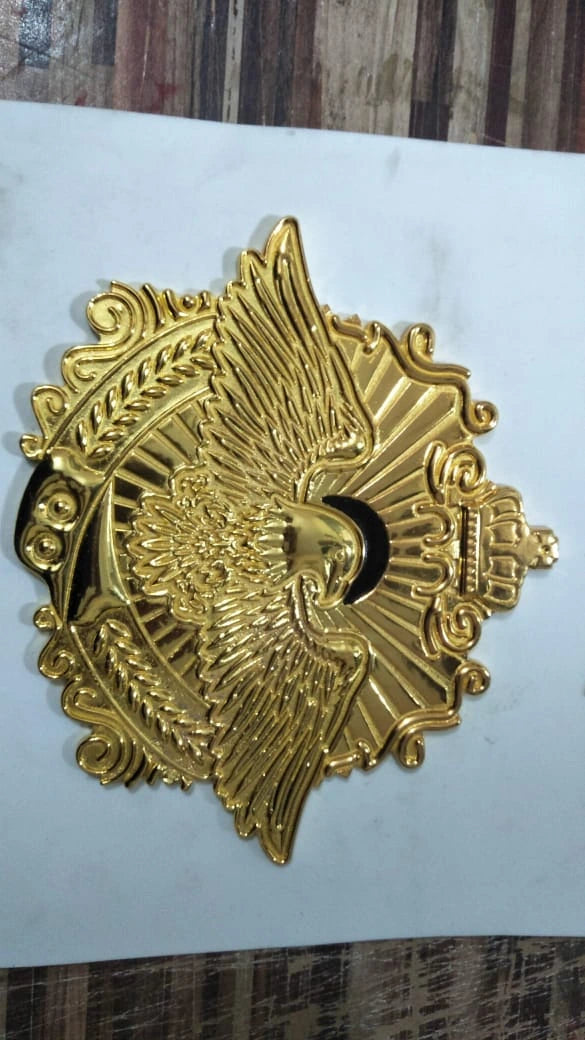 Large gold eagle center plate used for custom title belt design.