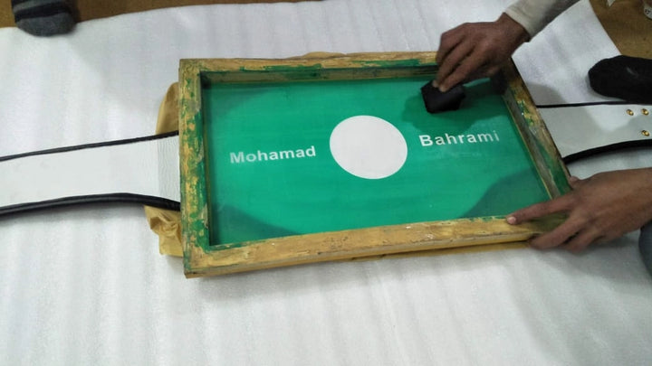Screen setup process for printing Japan flag on back of custom championship belt.