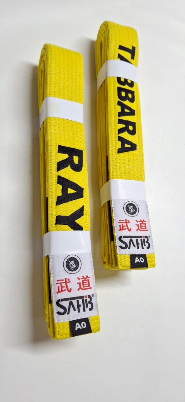 "Custom BJJ belt with embroidered name – front view"