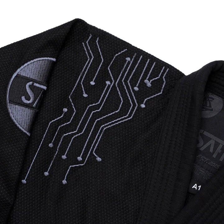  Left embroidery close-up of Sahib® Artificial Series BJJ Gi – black kimono featuring modern AI artwork