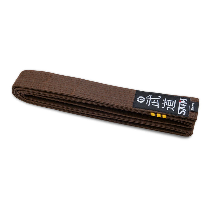 Full view of brown karate belt with three gold stripes
