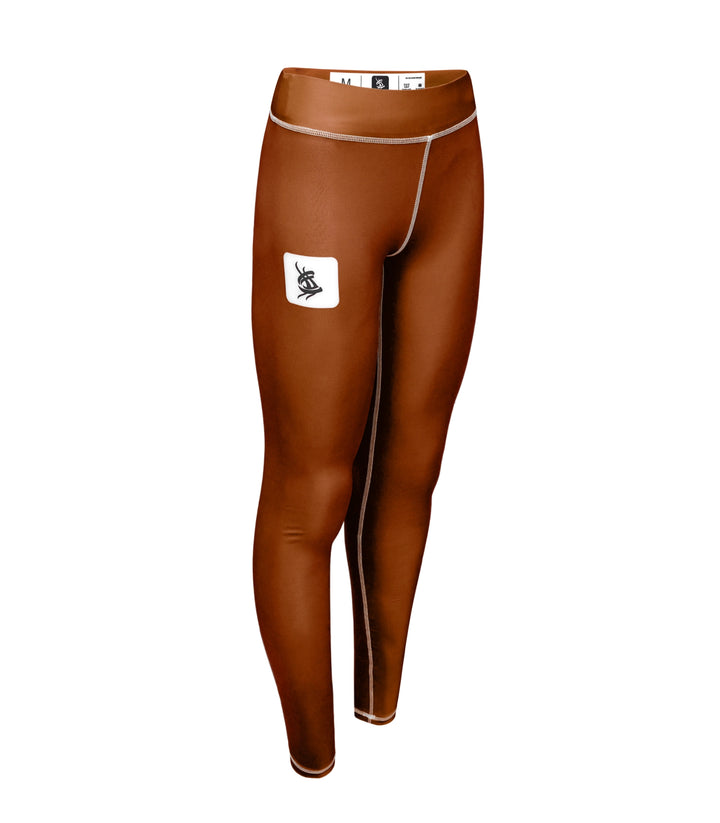Left angle dynamic view of Sahib® brown grappling leggings – ideal for MMA and jiu-jitsu movement