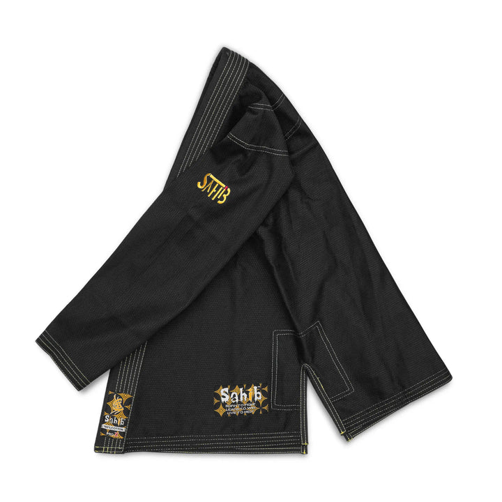 Left profile of young athlete wearing Sahib black youth BJJ gi jacket