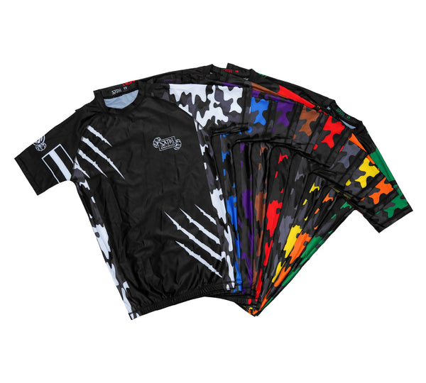 Sahib® Knuckles multicolor ranked rashguards collection — compression fit BJJ and MMA training gear in red, gray, yellow, orange, green, and brown