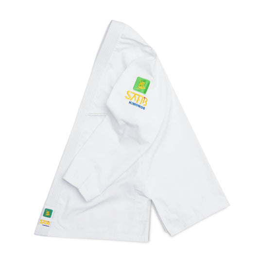 Side profile of Sahib® Travel BJJ Gi – compact white gi designed for mobility and comfort