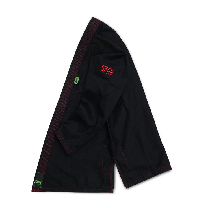 Side view of Sahib® UAE Series V2 black/red gi jacket – stylish and breathable martial arts gear