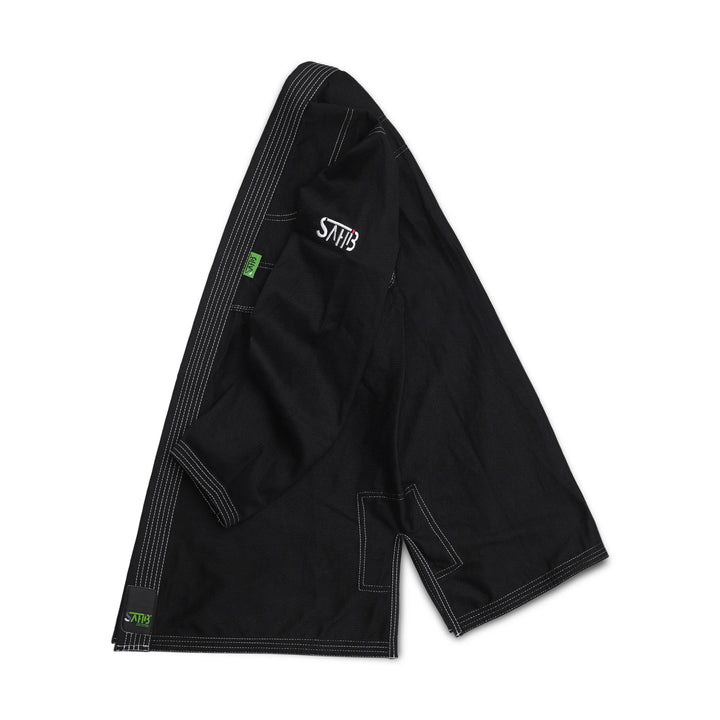 Side view of Sahib® UAE Series V2 black/white BJJ gi jacket – durable grappling uniform for daily rolling sessions