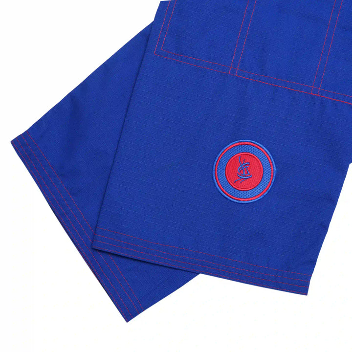 Embroidery close-up on Sahib® UAE Series V2 gi trousers – blue and red colorway for elite BJJ academy training gear