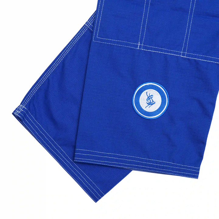 Embroidery detail on blue/white Sahib® UAE Series V2 gi pants – modern styling for lightweight Jiu Jitsu wear